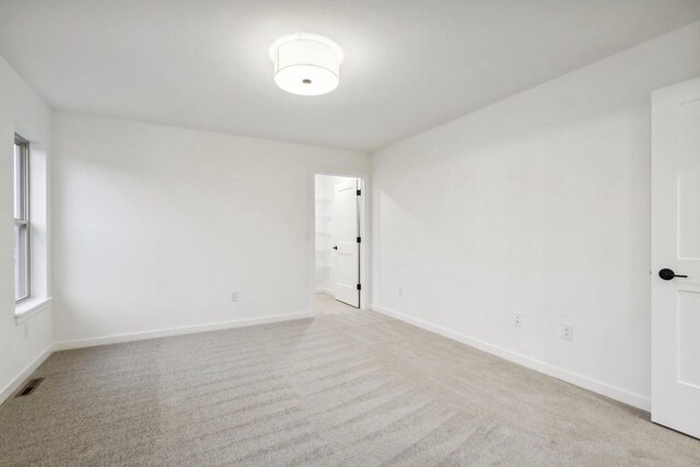 N174W20582 Laurel Springs Cir, Jackson, WI 53037 - empty room with baseboards, visible vents, and light colored carpet