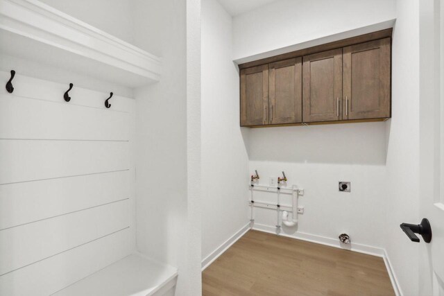 N174W20582 Laurel Springs Cir, Jackson, WI 53037 - mudroom featuring light wood-style flooring and baseboards