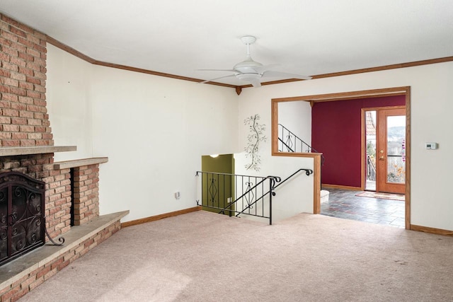 4191 Aspen Ln, La Crescent, MN 55947 - unfurnished living room with carpet floors, a fireplace, baseboards, and crown molding