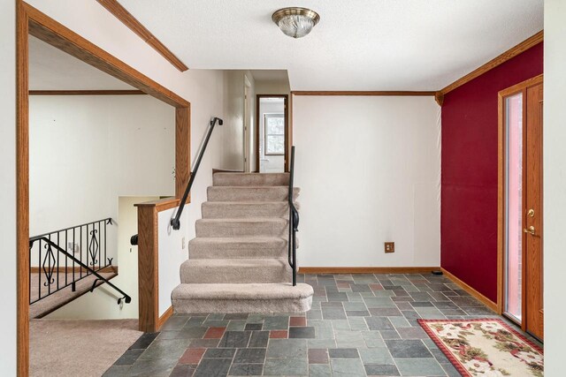 4191 Aspen Ln, La Crescent, MN 55947 - entrance foyer featuring baseboards, stone finish flooring, stairway, and crown molding
