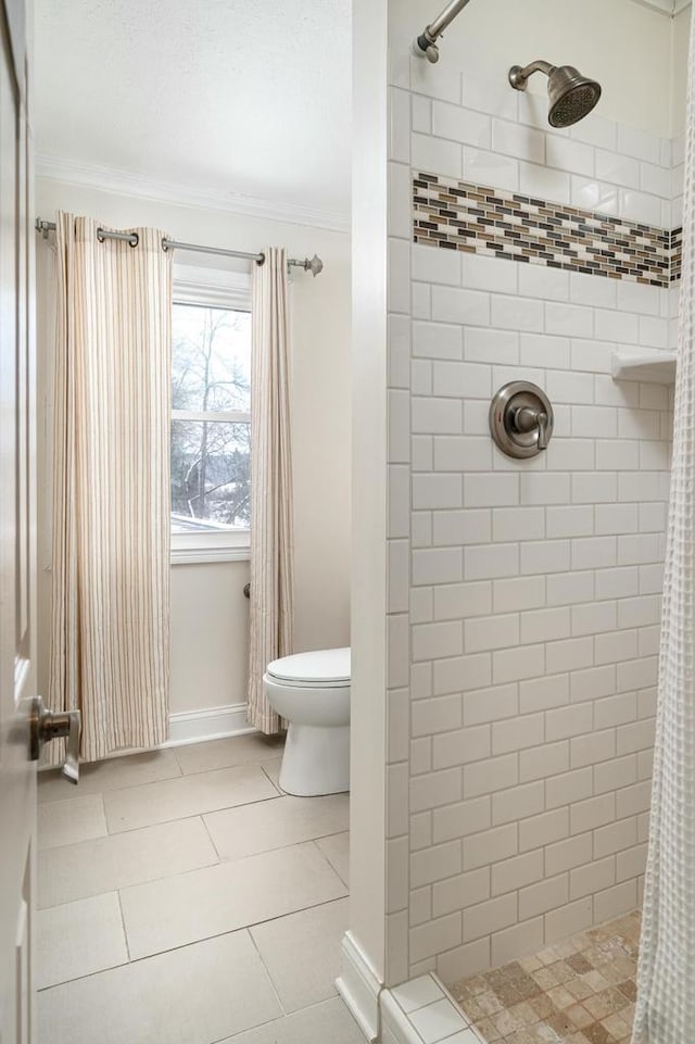 4191 Aspen Ln, La Crescent, MN 55947 - full bath with crown molding, toilet, a stall shower, tile patterned flooring, and baseboards