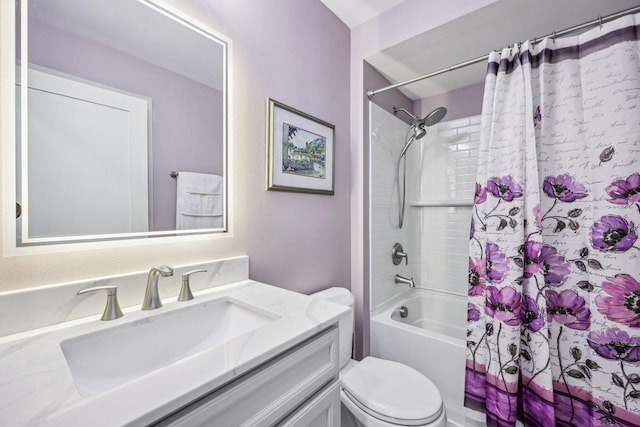 full bathroom featuring toilet, shower / bath combo with shower curtain, and vanity