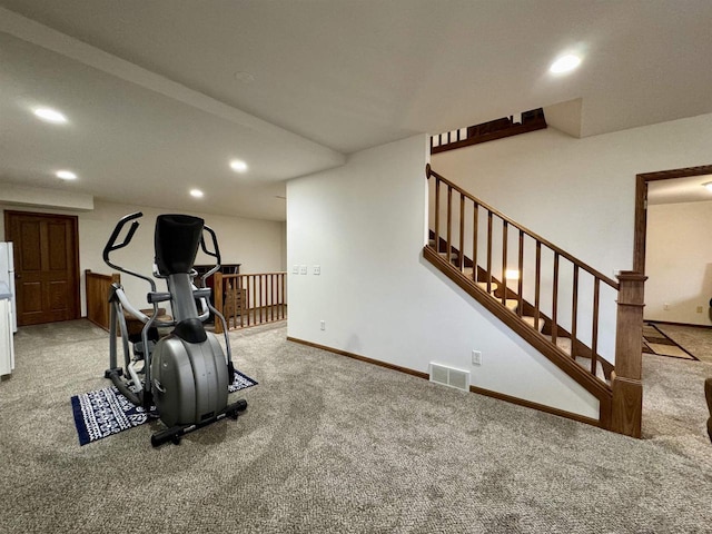 exercise room with baseboards, visible vents, carpet flooring, and recessed lighting