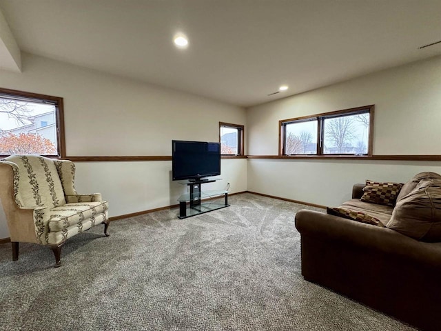 carpeted living room with a healthy amount of sunlight, baseboards, and recessed lighting