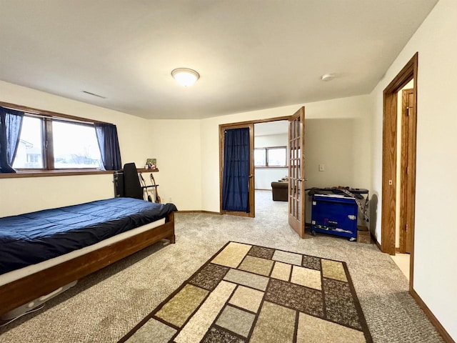 carpeted bedroom with baseboards