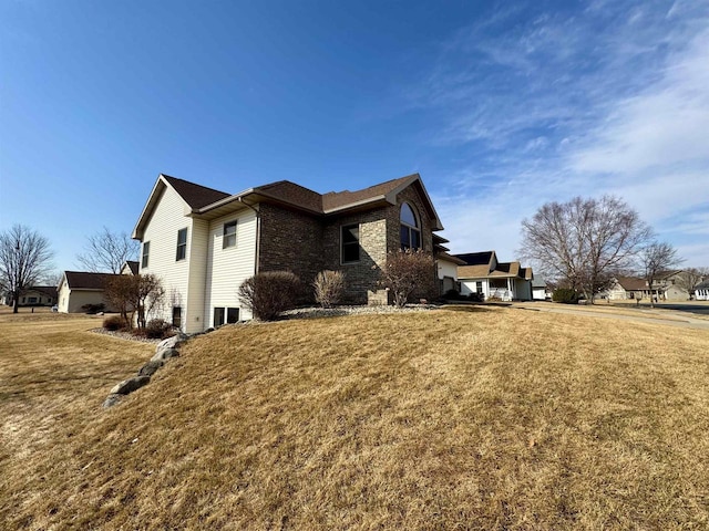 view of property exterior with a yard