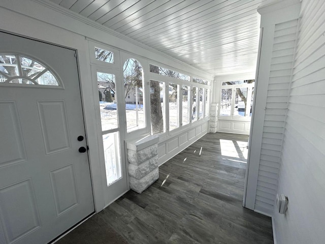 unfurnished sunroom featuring wooden ceiling