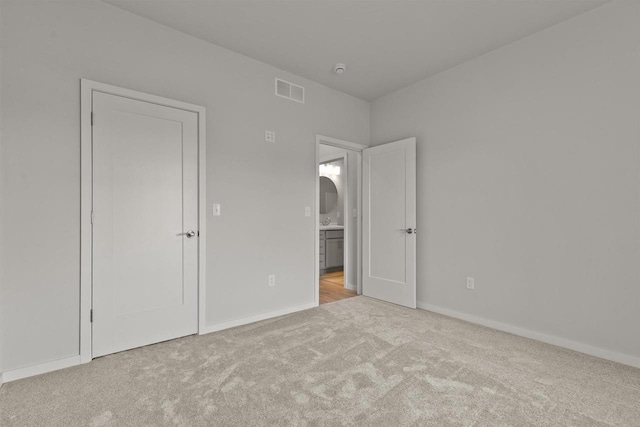 3687 Callalilly Ln, Appleton, WI 54913 - unfurnished bedroom featuring carpet flooring and arched walkways
