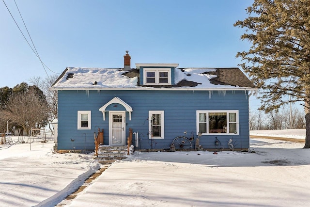 view of front of home featuring a chimney