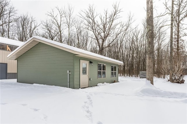 exterior space with a detached garage