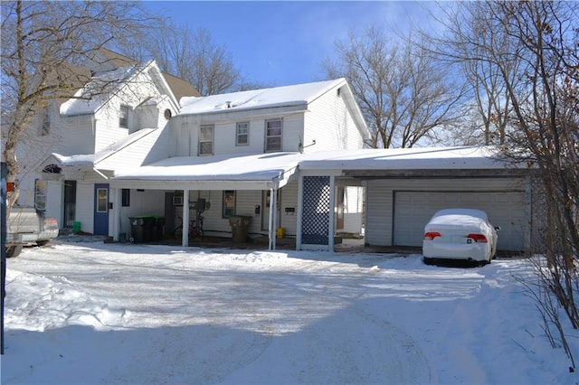 view of front facade featuring an attached garage and a carport