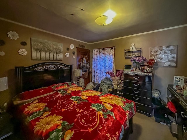 bedroom featuring ornamental molding and carpet flooring