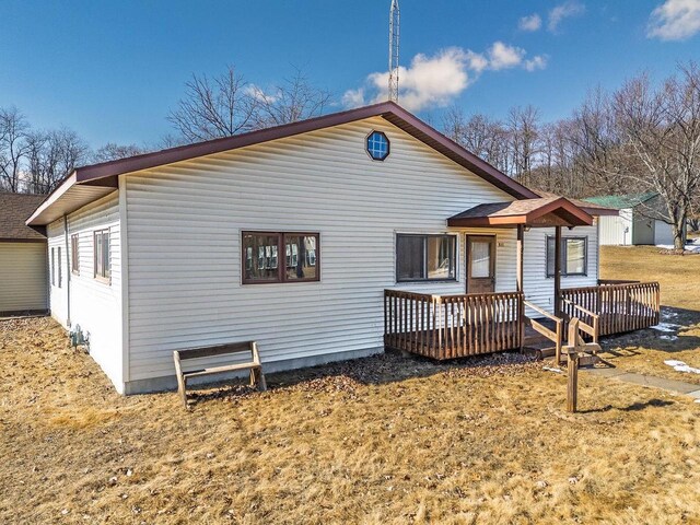 rear view of property with a deck