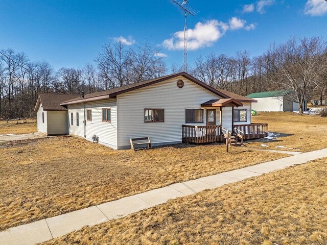 ranch-style home with a deck