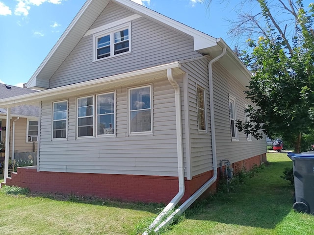 view of property exterior with a yard