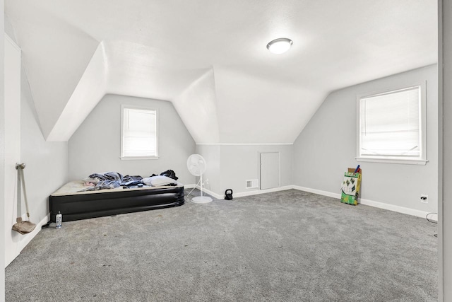 bonus room with lofted ceiling, carpet flooring, and baseboards