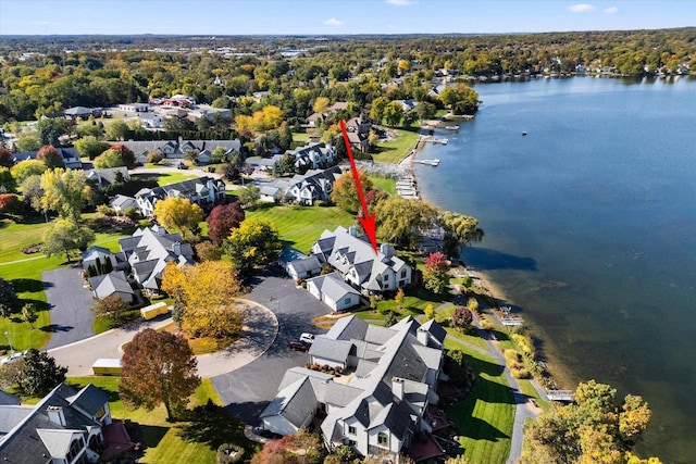 birds eye view of property featuring a water view and a residential view