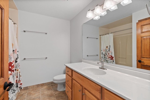 full bath featuring toilet and vanity