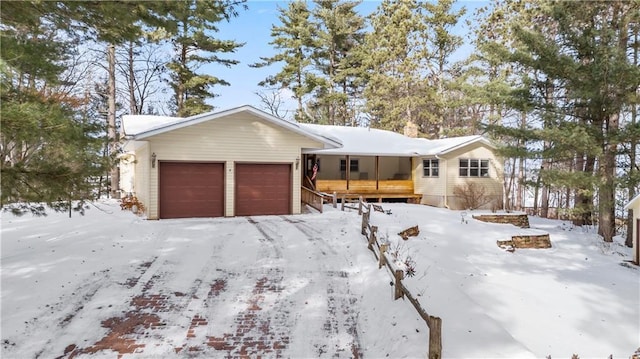 view of front of property with a garage and a porch