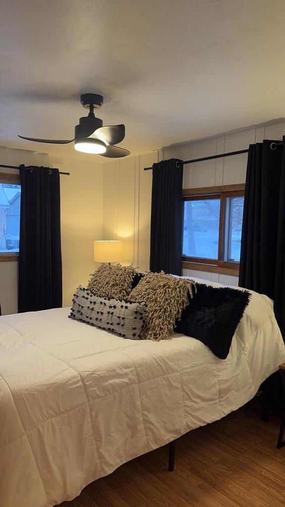 bedroom featuring ceiling fan and wood finished floors