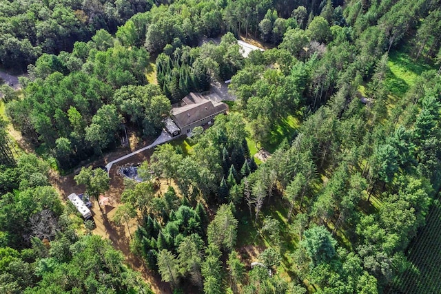 bird's eye view featuring a wooded view