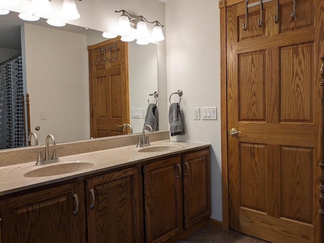 bathroom featuring a sink and double vanity