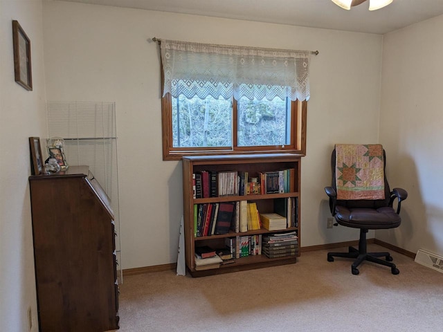 sitting room with baseboards, visible vents, and carpet flooring