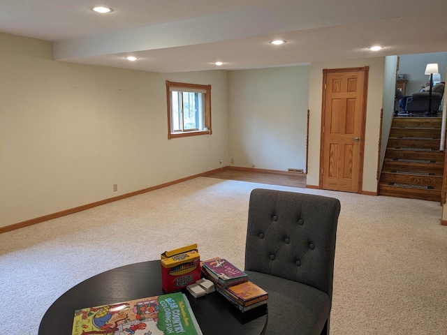 sitting room featuring stairs, carpet floors, recessed lighting, and baseboards