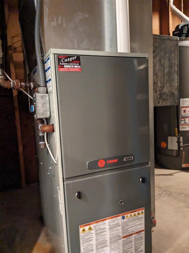 utilities featuring gas water heater and heating unit