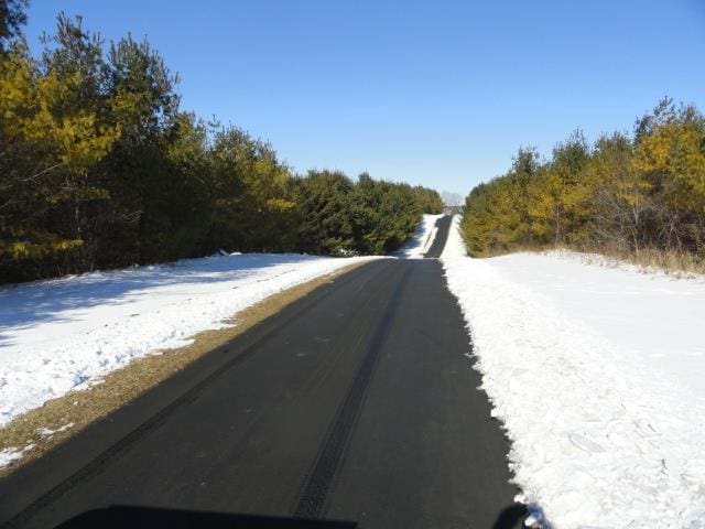 N5194 Blue Valley Rd, Hartford, WI 53027 - view of asphalt street featuring a forest view
