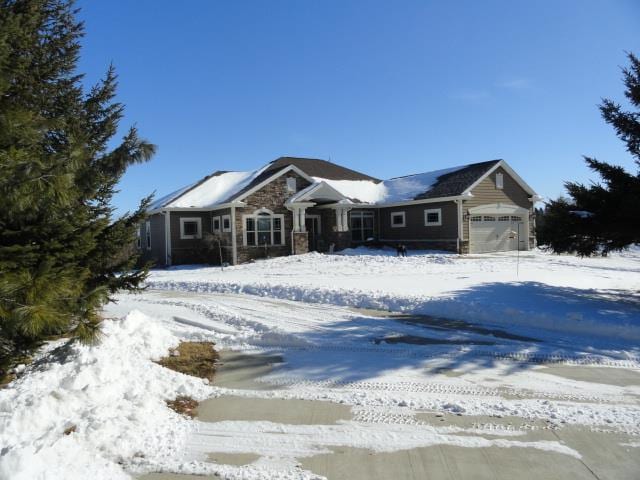 N5194 Blue Valley Rd, Hartford, WI 53027 - ranch-style house featuring an attached garage and stone siding