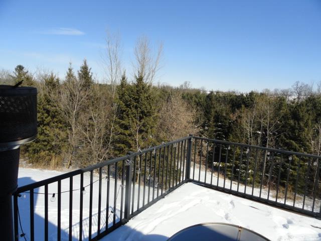 N5194 Blue Valley Rd, Hartford, WI 53027 - balcony with a view of trees