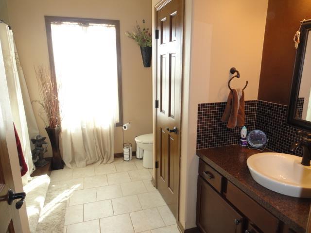 N5194 Blue Valley Rd, Hartford, WI 53027 - bathroom with toilet, tile patterned floors, and vanity