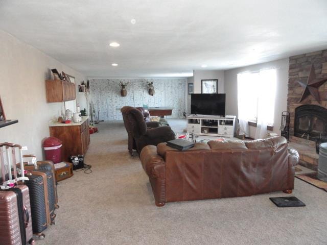 N5194 Blue Valley Rd, Hartford, WI 53027 - living room with light colored carpet, a stone fireplace, and recessed lighting