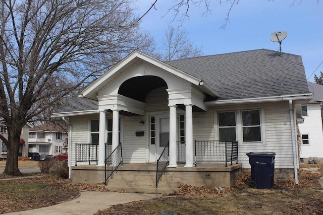 view of front facade featuring roof with shingles