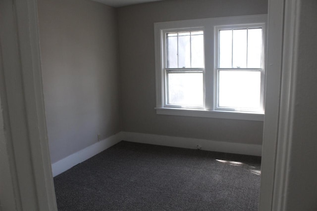 empty room with carpet flooring and baseboards