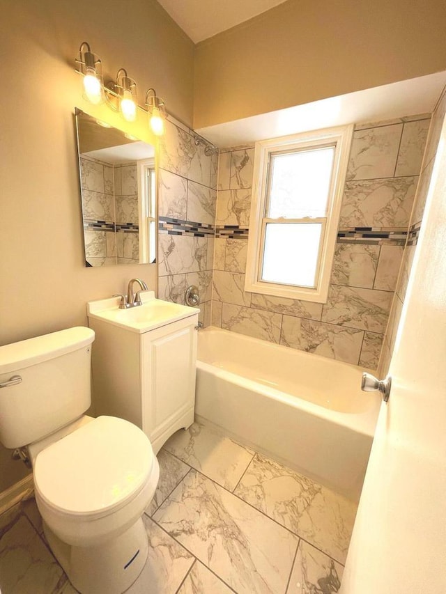 full bath featuring toilet, marble finish floor, bathing tub / shower combination, and vanity