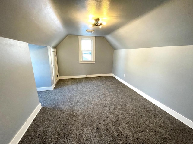 bonus room featuring lofted ceiling, baseboards, and visible vents