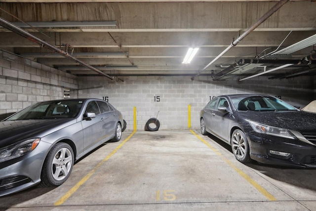 parking garage featuring concrete block wall