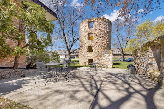 view of patio featuring outdoor dining area