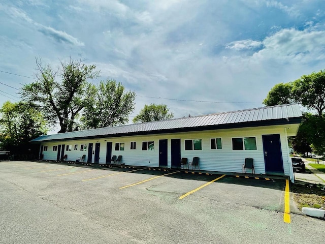 view of property featuring uncovered parking