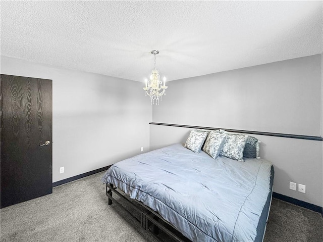 bedroom featuring a notable chandelier, carpet, baseboards, and a textured ceiling