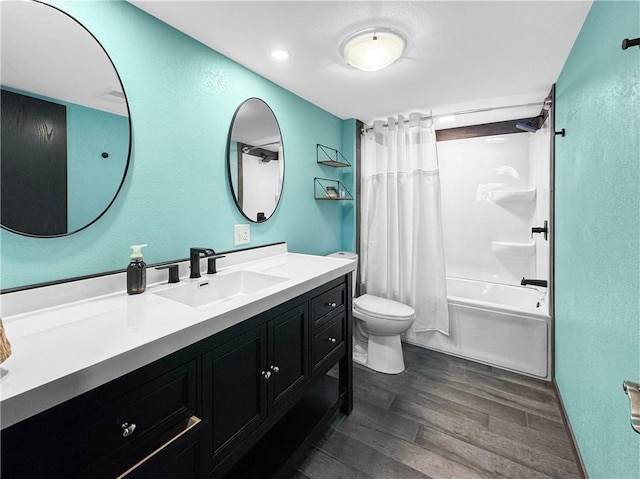 bathroom featuring toilet, shower / bathtub combination with curtain, wood finished floors, and vanity