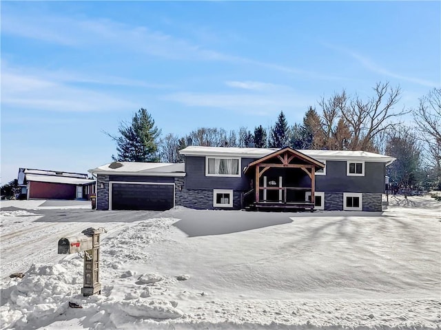 split foyer home with stone siding