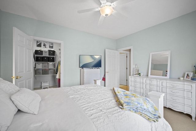 carpeted bedroom with a ceiling fan