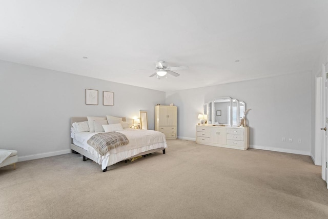 bedroom with light carpet, ceiling fan, and baseboards