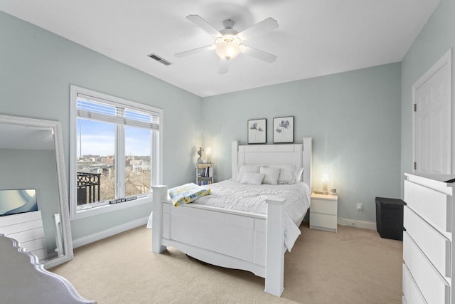 bedroom with baseboards, visible vents, ceiling fan, and light colored carpet