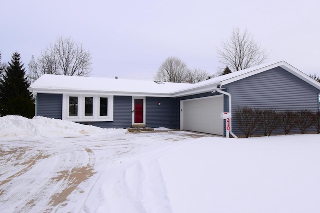 ranch-style house with entry steps and an attached garage