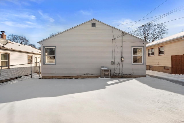 rear view of property with fence