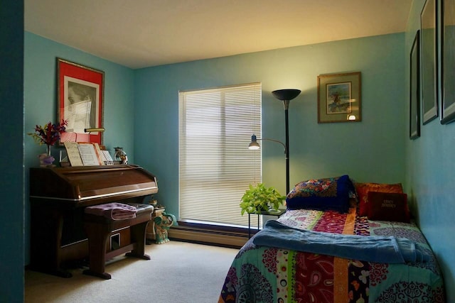 carpeted bedroom with baseboard heating